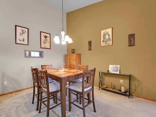 1734 Parkstone Ter Unit 73, Mount Pleasant, WI 53406 - dining area with a chandelier, light carpet, a high ceiling, and baseboards