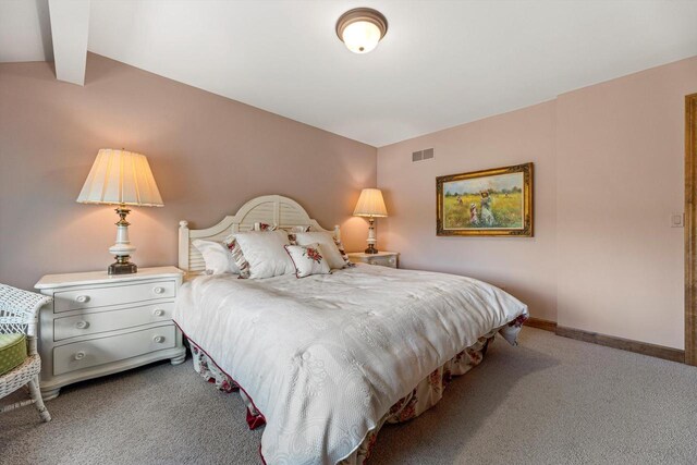 bedroom featuring carpet floors, lofted ceiling with beams, baseboards, and visible vents
