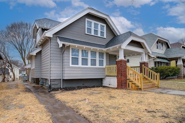 view of front of property with a shingled roof