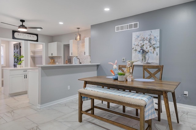 dining space with baseboards, recessed lighting, visible vents, ceiling fan, and marble finish floor