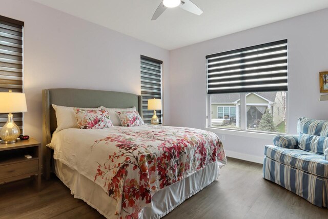 bedroom with baseboards, a ceiling fan, and wood finished floors