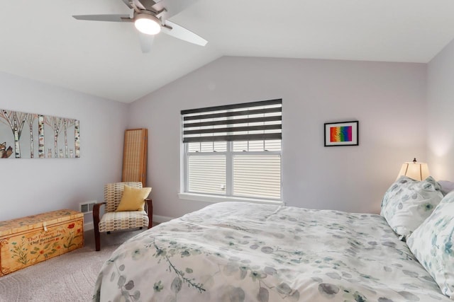 bedroom with visible vents, a ceiling fan, carpet flooring, and vaulted ceiling
