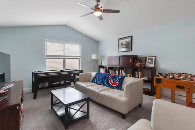 living room with ceiling fan, carpet, and lofted ceiling