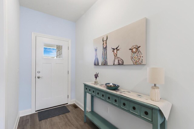 entryway with baseboards and dark wood finished floors