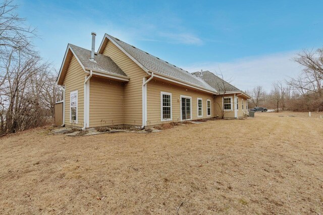 W209N11385 Reger Ct, Germantown, WI 53022 - back of house featuring a yard and a shingled roof
