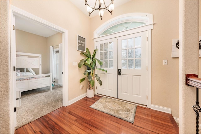 W209N11385 Reger Ct, Germantown, WI 53022 - foyer entrance with baseboards, a chandelier, and wood finished floors