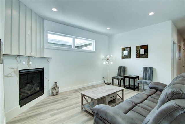 2480 116th St, Chippewa Falls, WI 54729 - living room with light wood-style floors, a high end fireplace, baseboards, and recessed lighting