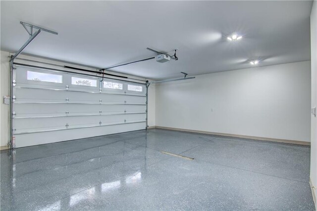 2480 116th St, Chippewa Falls, WI 54729 - garage with baseboards and a garage door opener