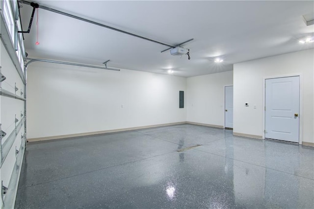 2480 116th St, Chippewa Falls, WI 54729 - garage featuring electric panel, baseboards, and a garage door opener