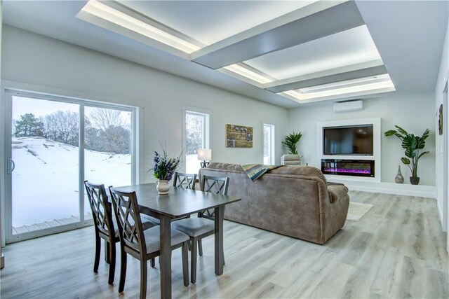 2480 116th St, Chippewa Falls, WI 54729 - dining space with light wood-style flooring, a raised ceiling, and a wall mounted AC