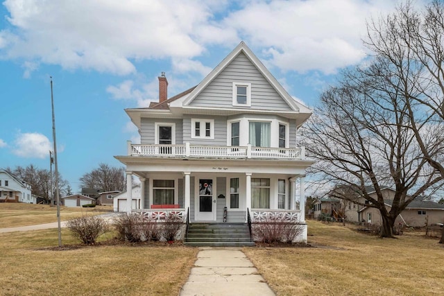 158 E Water St, Shullsburg, WI 53586 - view of front of property featuring a front yard, a chimney, and covered porch