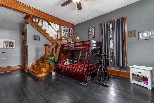 158 E Water St, Shullsburg, WI 53586 - bedroom with wood finished floors, baseboards, and a ceiling fan