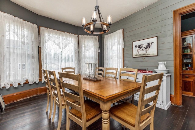 158 E Water St, Shullsburg, WI 53586 - dining room with a chandelier, wood walls, wood-type flooring, and a wealth of natural light