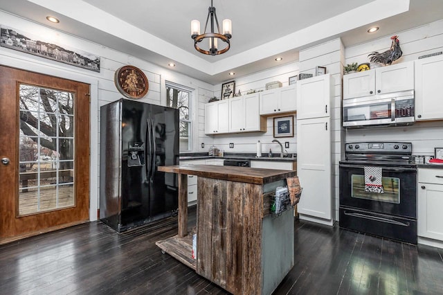 158 E Water St, Shullsburg, WI 53586 - kitchen with white cabinets, an inviting chandelier, a sink, butcher block counters, and black appliances