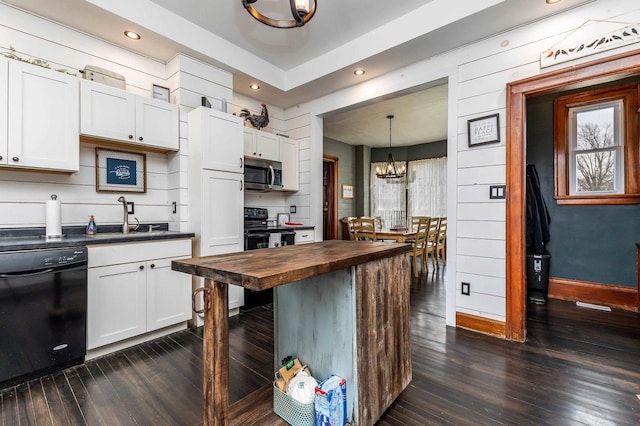 158 E Water St, Shullsburg, WI 53586 - kitchen with dark wood finished floors, black appliances, a sink, wooden counters, and a notable chandelier