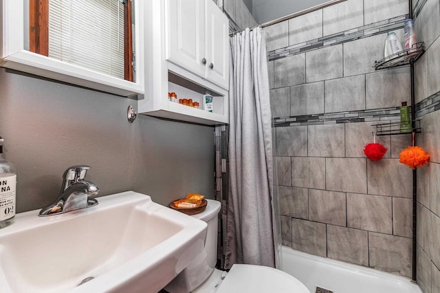 158 E Water St, Shullsburg, WI 53586 - bathroom with a shower stall, a sink, and toilet