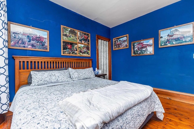 158 E Water St, Shullsburg, WI 53586 - bedroom featuring wood-type flooring and baseboards