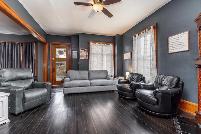 158 E Water St, Shullsburg, WI 53586 - living area featuring dark wood-style flooring, baseboards, and a ceiling fan