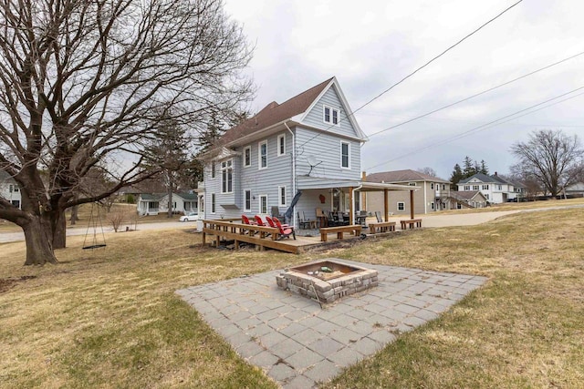 158 E Water St, Shullsburg, WI 53586 - rear view of house with a yard, an outdoor fire pit, a wooden deck, and a patio