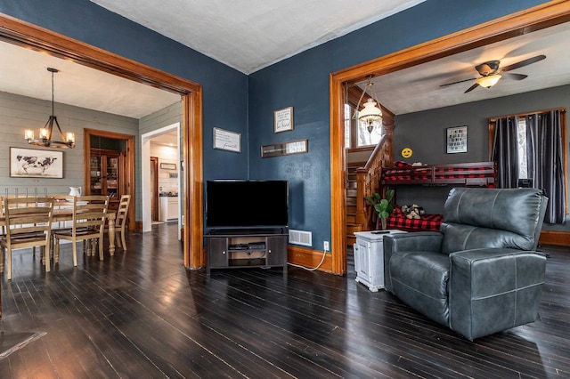 158 E Water St, Shullsburg, WI 53586 - living room with baseboards, wood finished floors, and ceiling fan with notable chandelier