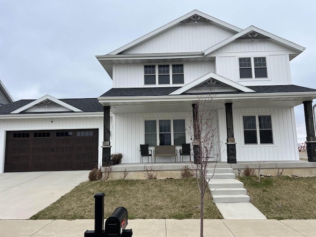 3102 Hope St, Sun Prairie, WI 53590 - view of front of house with roof with shingles, a porch, a garage, and concrete driveway