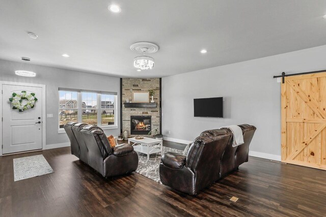 3102 Hope St, Sun Prairie, WI 53590 - living area featuring a fireplace, baseboards, and dark wood finished floors
