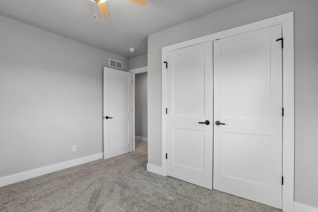 3102 Hope St, Sun Prairie, WI 53590 - unfurnished bedroom with visible vents, baseboards, a closet, ceiling fan, and carpet floors