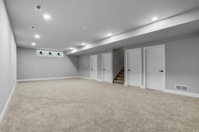 3102 Hope St, Sun Prairie, WI 53590 - basement with stairs, carpet flooring, visible vents, and baseboards