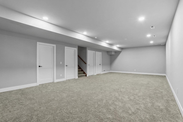 3102 Hope St, Sun Prairie, WI 53590 - finished below grade area with recessed lighting, stairs, carpet flooring, and visible vents