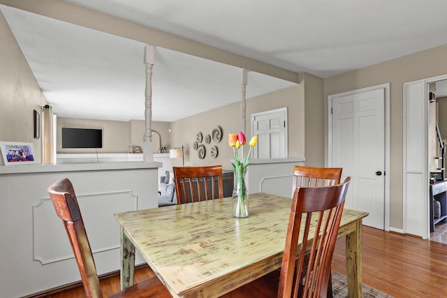 dining area with wood finished floors