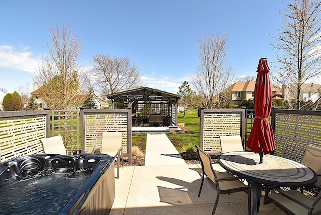 view of patio with a gazebo and a hot tub