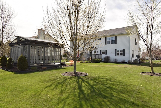 view of yard with a sunroom