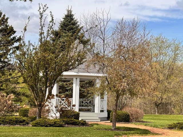 view of property's community with a lawn