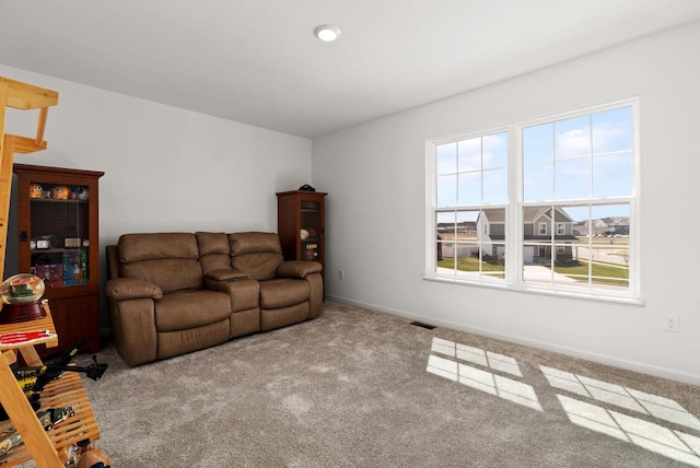 708 Narvik Cir, Stoughton, WI 53589 - living room with carpet, visible vents, and baseboards