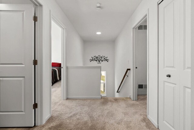 708 Narvik Cir, Stoughton, WI 53589 - hallway featuring visible vents, an upstairs landing, carpet, and recessed lighting