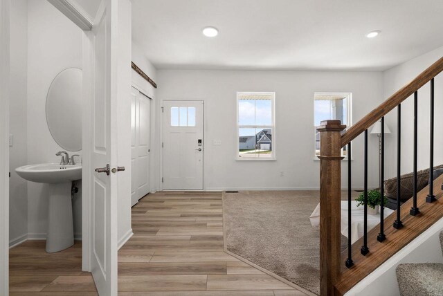 708 Narvik Cir, Stoughton, WI 53589 - entryway featuring light wood-style flooring, recessed lighting, and stairs