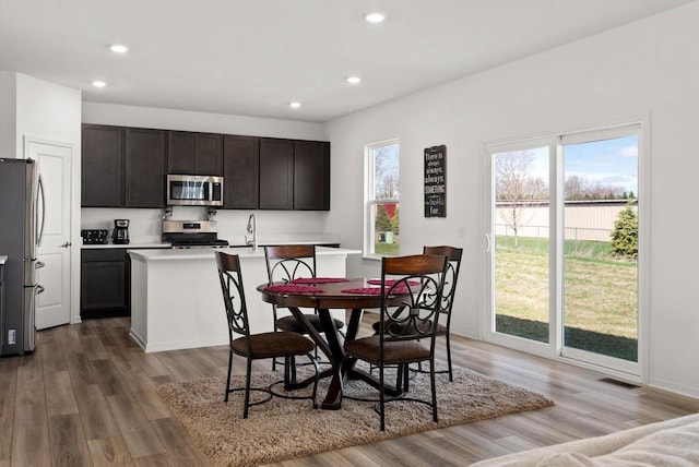 708 Narvik Cir, Stoughton, WI 53589 - dining room featuring light wood-style flooring, visible vents, and recessed lighting