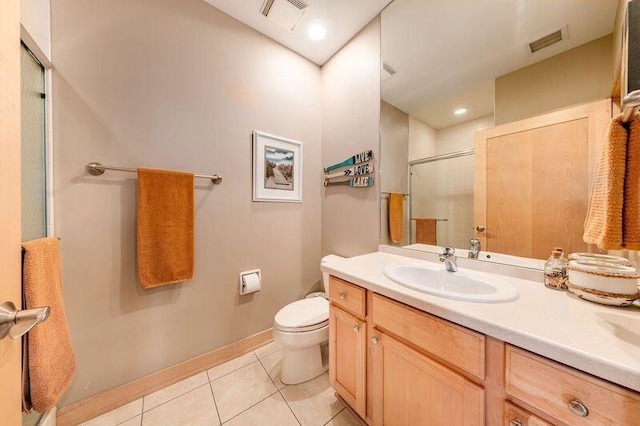 full bathroom with toilet, visible vents, tile patterned floors, and a shower with shower door
