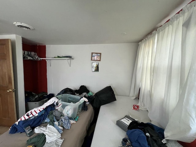 bedroom featuring visible vents