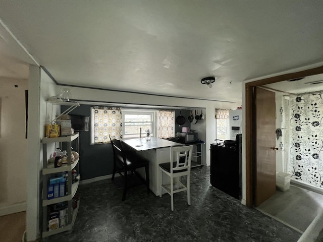 dining room with baseboards
