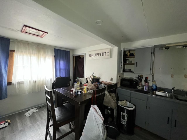 dining room with baseboards and wood finished floors