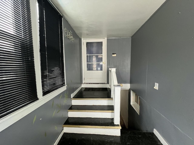 staircase with concrete floors
