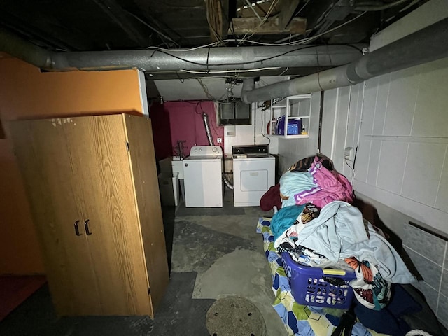 unfinished basement with washer and clothes dryer