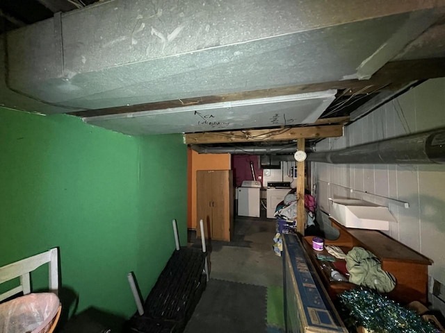 unfinished basement with washer / clothes dryer