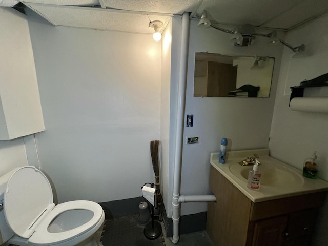 bathroom featuring toilet and vanity