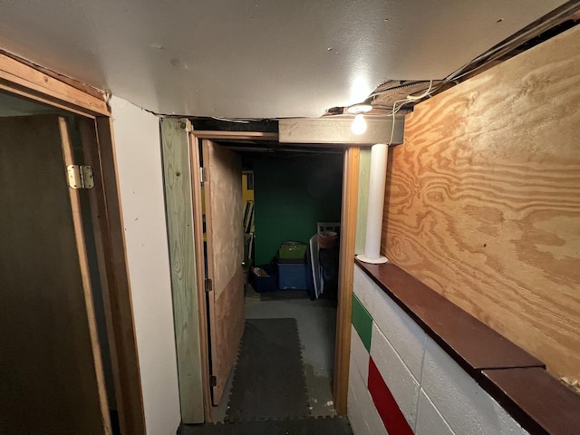 hall with concrete flooring