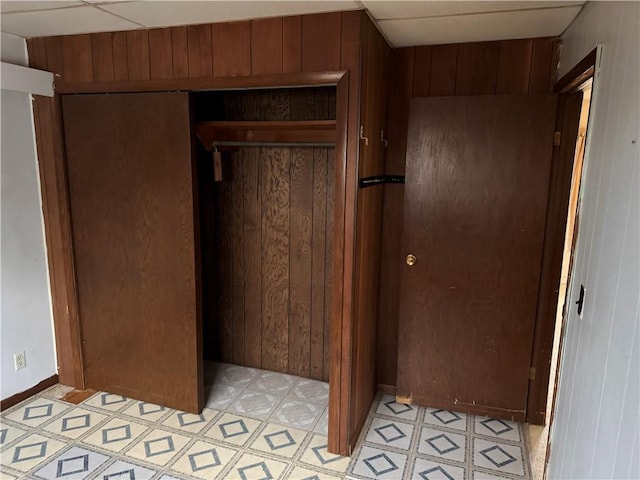 W5588 US Highway 8, Tony, WI 54563 - interior space featuring wooden walls, a closet, and baseboards