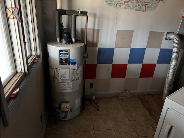 W5588 US Highway 8, Tony, WI 54563 - utility room featuring water heater and washer / dryer