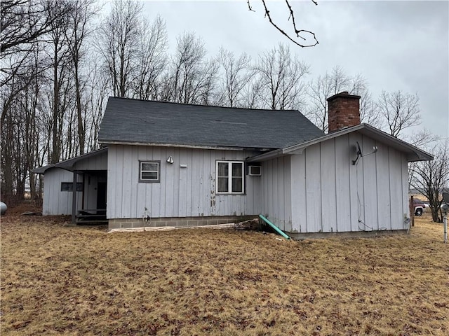 W5588 US Highway 8, Tony, WI 54563 - back of property featuring a shingled roof and a chimney