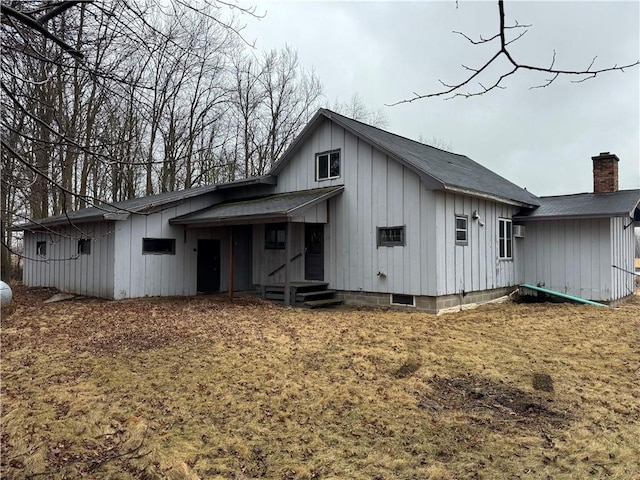 W5588 US Highway 8, Tony, WI 54563 - back of property featuring board and batten siding and a chimney